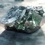 Terbium appears as a soft, silvery-gray metal with a smooth and slightly reflective surface, showcasing its malleability and ductility.