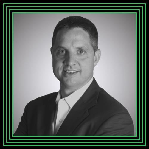 black and white photo of a man in a suit, showcasing the elegance often associated with chromatography refining