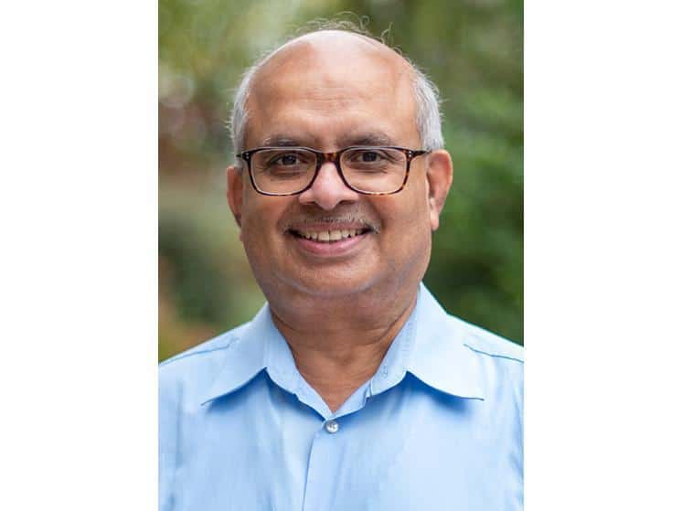 man wearing glasses and a blue shirt, critical minerals recovery