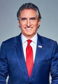 man in a blue suit and red tie