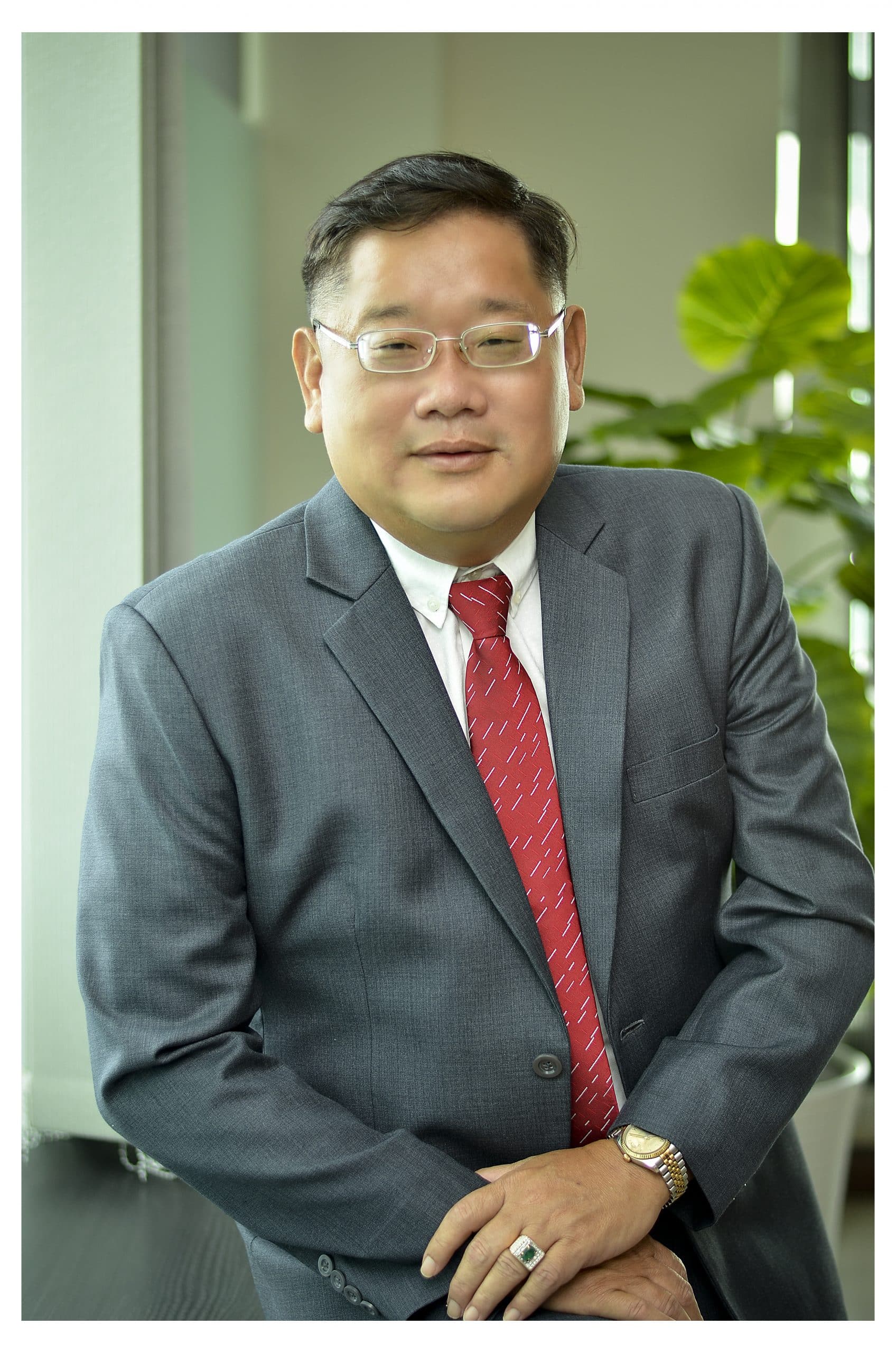 man in a suit and tie posing for a picture, critical minerals