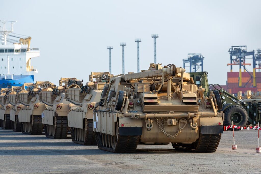line of military vehicles parked next to each other