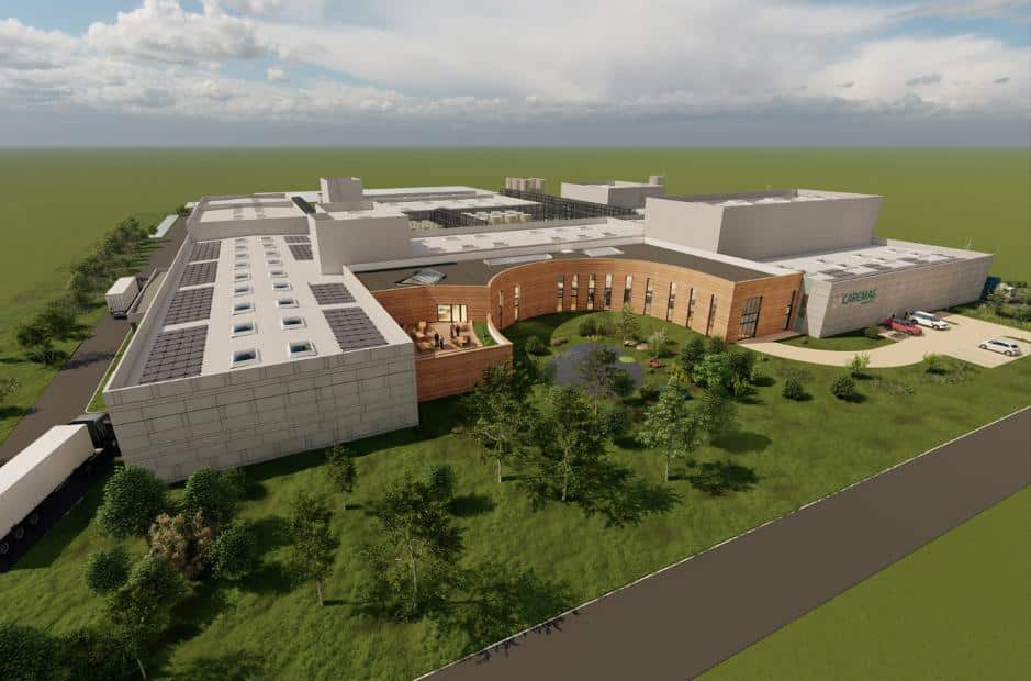 aerial view of a large building in the middle of a field related to rare earth processing