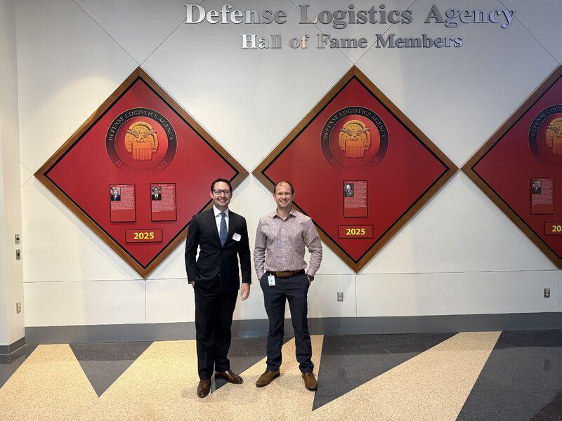 couple of men standing next to each other using strategic magnet technology