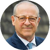 man in a suit and tie with glasses, representing Pensana Longonjo Angola