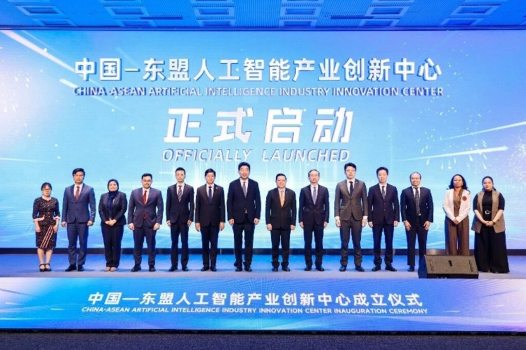 Officials and delegates stand on stage at the China-ASEAN Artificial Intelligence Industry Innovation Center inauguration cer