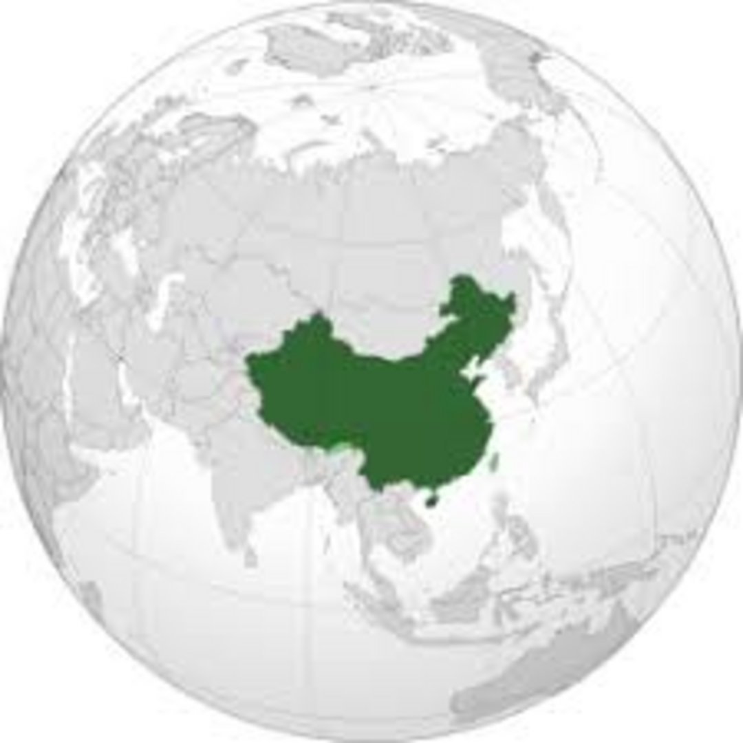 China's territory marked in dark green on a transparent orthographic globe centered on Asia and the Pacific region