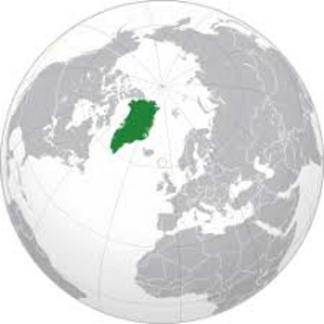 Greenland highlighted in green on an orthographic globe projection centered on the Arctic Ocean, flanked by North America and
