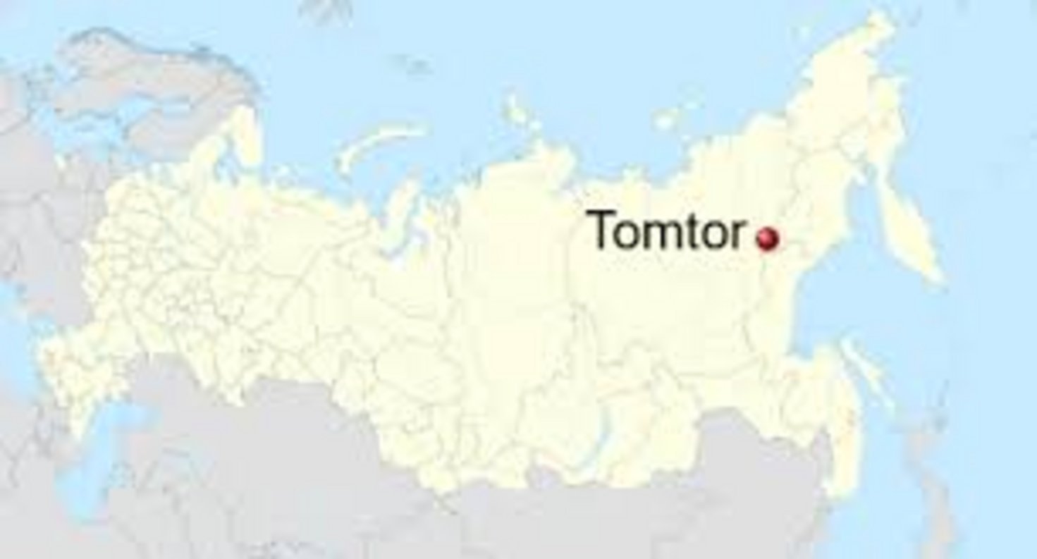 Red dot marking Tomtor settlement in Oymyakon District, Sakha Republic, northeastern Siberia on a political map of Russia