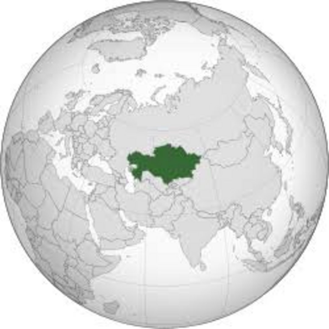 Kazakhstan highlighted in dark green on an orthographic globe projection, bordered by Russia, China, Kyrgyzstan, Uzbekistan,