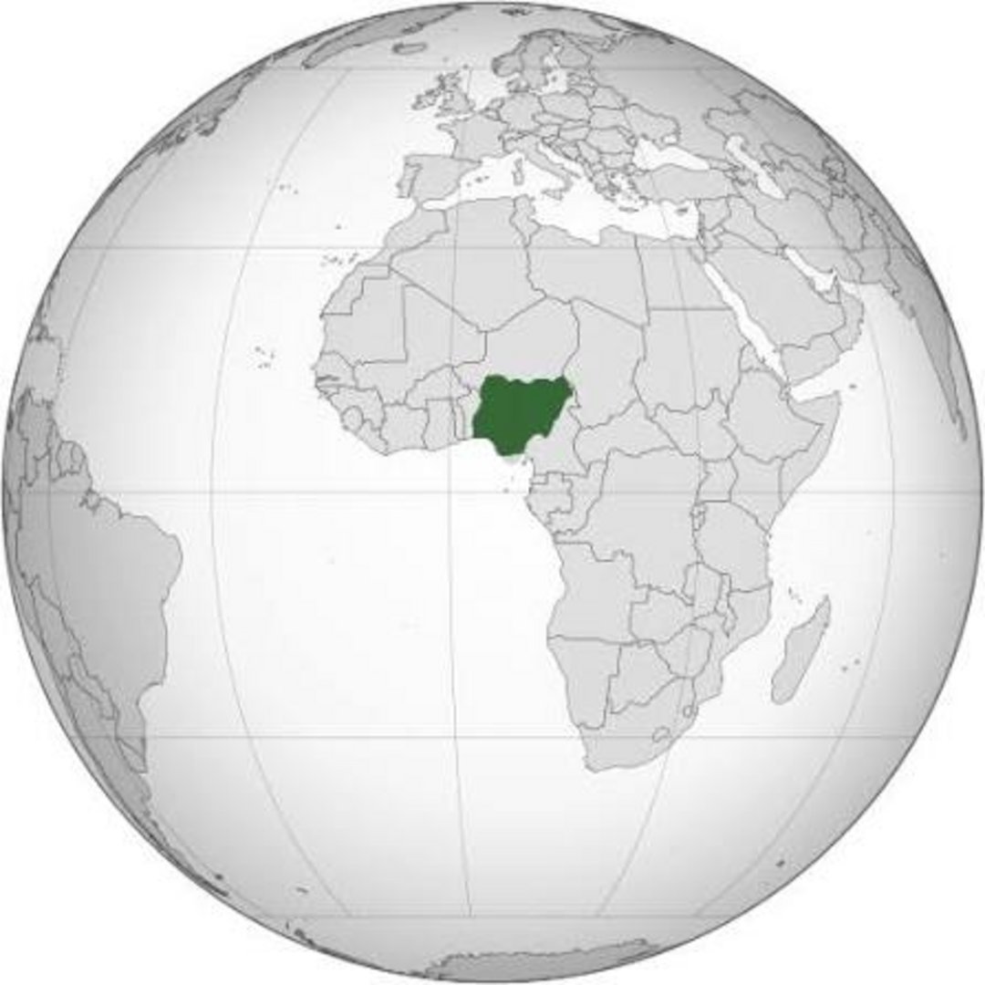 Orthographic globe map with Nigeria marked in dark green in West Africa, surrounded by grey neighboring countries and contine