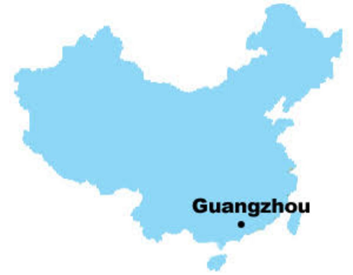 Blue silhouette map of China with a black dot marking Guangzhou city in Guangdong Province in southern China