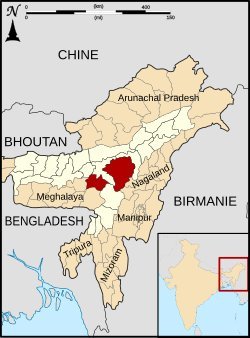 Political map of Northeast India with Assam and Nagaland in dark red, bordered by Bhutan, China, Bangladesh, and Myanmar, Fre