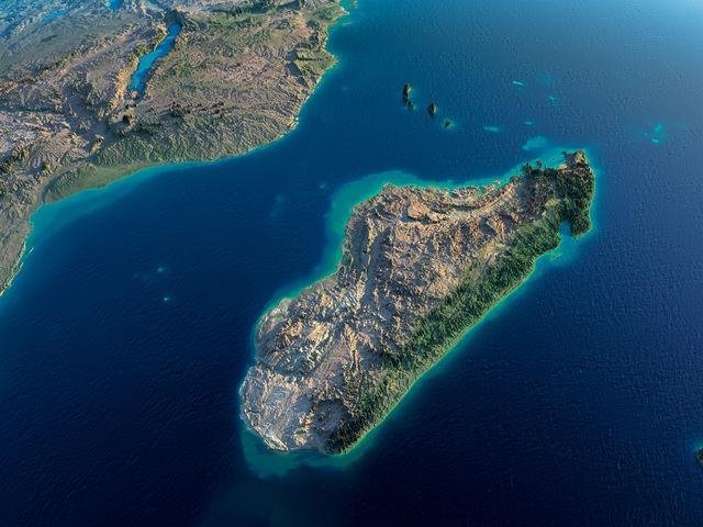 Aerial satellite view of Madagascar island in the Indian Ocean with the southeastern African coastline visible in the backgro