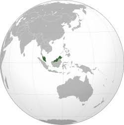 Orthographic globe map highlighting Malaysia in dark green, spanning Peninsular Malaysia and East Malaysia on Borneo island i