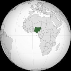 Nigeria marked in dark green on a globe map, located in West Africa along the Gulf of Guinea, bordered by Benin, Niger, Chad,