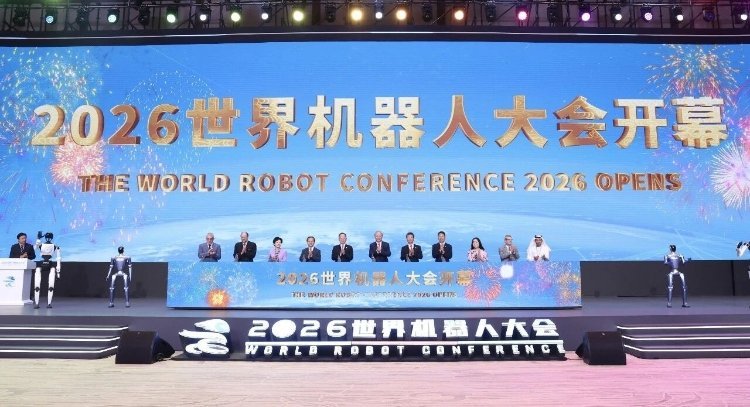Officials and dignitaries stand on stage at the World Robot Conference 2026 opening ceremony in China, flanked by humanoid ro