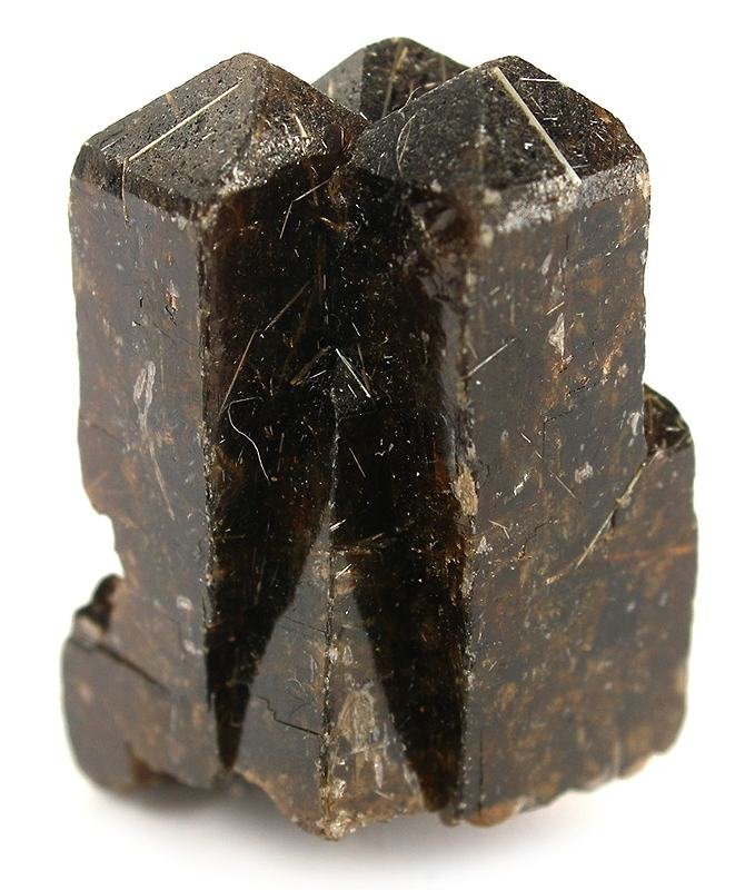 Dark brown vesuvianite idocrase tetragonal prismatic crystal cluster with vitreous luster and fibrous inclusions on white bac