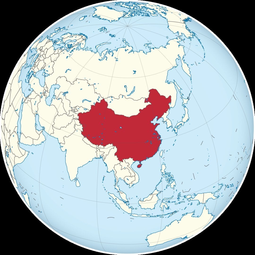 China marked in dark red on a globe map, spanning East Asia with borders of Russia, India, Mongolia and Southeast Asian natio